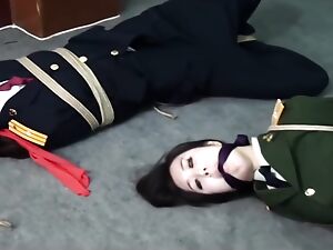 Japanese officers indulge in dominating and submitting in a steamy office encounter.